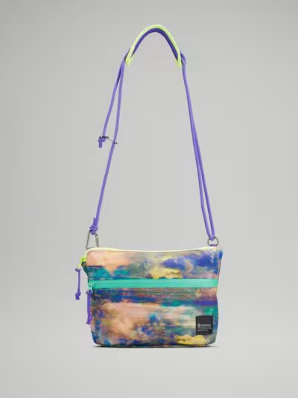 Lululemon Patch Logo Cross Body Bag in the color Altered Nature Multi
